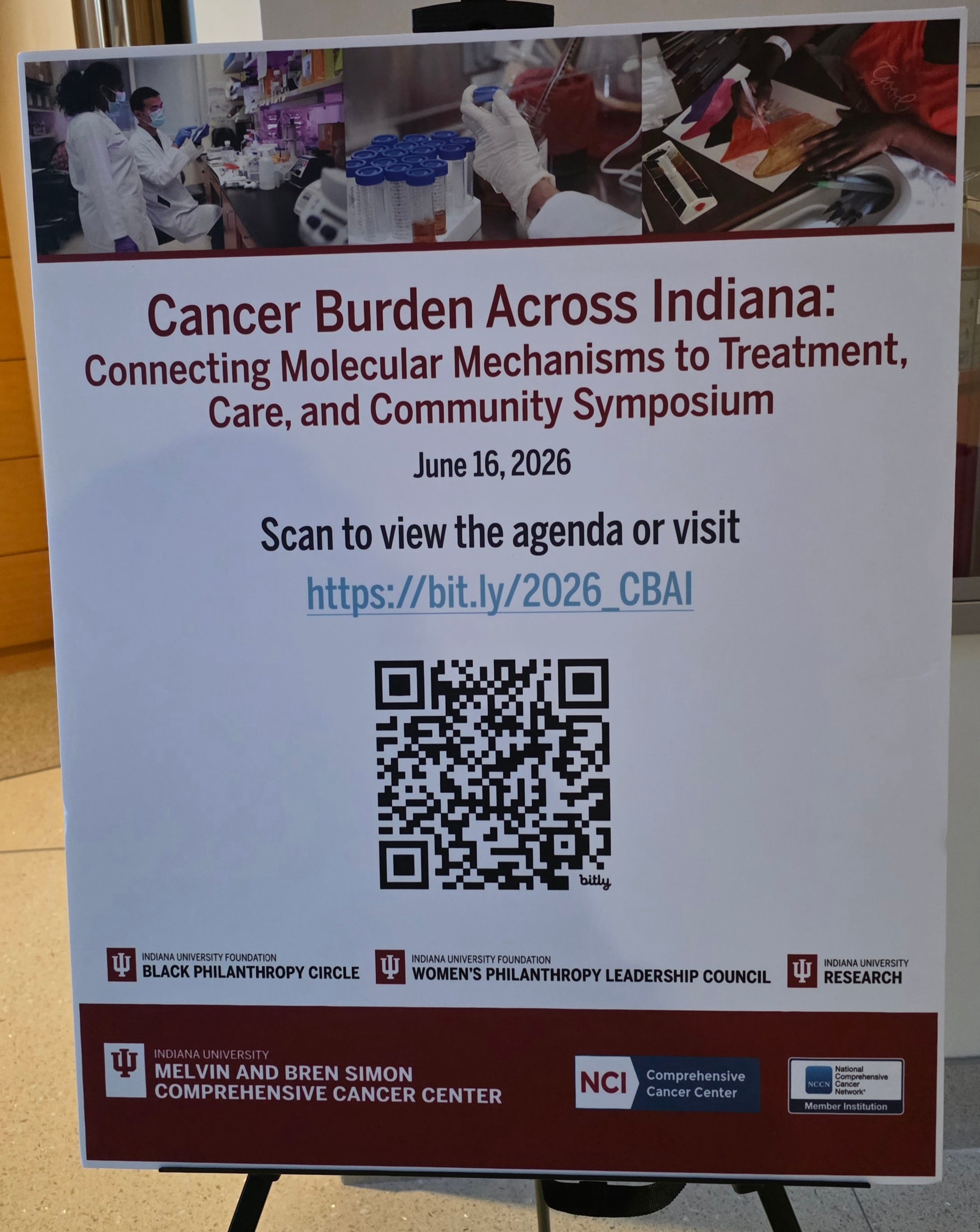 Cancer Burden Across Indiana: Connecting Molecular Mechanisms to Treatment, Care, and Community Symposium — June 16, 2026 event sign at IU Melvin and Bren Simon Comprehensive Cancer Center